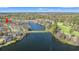 Aerial view of the neighborhood and lake, featuring golf course in the background at 113 Preservation Dr., Myrtle Beach, SC 29572