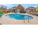 Relaxing backyard with pool, hot tub, patio, grill, and screened porch at 113 Preservation Dr., Myrtle Beach, SC 29572
