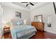 Bedroom with tray ceiling, hardwood floors, and a coordinated furniture set at 113 Preservation Dr., Myrtle Beach, SC 29572