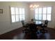 Spacious dining area with a round table, chandelier, and shuttered windows at 113 Preservation Dr., Myrtle Beach, SC 29572