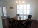 Well-lit dining room features a chandelier, wood floors, and shuttered windows at 113 Preservation Dr., Myrtle Beach, SC 29572