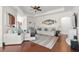 Spacious living room featuring hardwood floors, a tray ceiling, and stylish seating, offering a cozy retreat at 113 Preservation Dr., Myrtle Beach, SC 29572