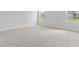 Spacious bedroom with plush carpeting and natural light at 1135 Nw Rosefield Way, Calabash, NC 28467