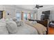 Main bedroom with ocean view, king-size bed, and hardwood floors at 1187 Norris Dr., Pawleys Island, SC 29585