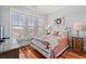 Guest bedroom with water views, queen-size bed, and wood floors at 1187 Norris Dr., Pawleys Island, SC 29585