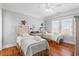 Bedroom with two twin beds, plenty of light, and hardwood floors at 1187 Norris Dr., Pawleys Island, SC 29585