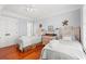 Bedroom with two twin beds, plenty of light, and hardwood floors at 1187 Norris Dr., Pawleys Island, SC 29585