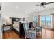 Main bedroom with ocean views, king-size bed, and two armchairs at 1187 Norris Dr., Pawleys Island, SC 29585