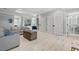 Open living room with access to kitchen and an attached bathroom at 1187 Norris Dr., Pawleys Island, SC 29585
