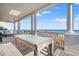 Relaxing oceanfront porch with table, chairs, and stunning ocean views at 1187 Norris Dr., Pawleys Island, SC 29585