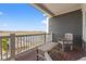 Deck overlooking the water with wooden chairs and table at 1187 Norris Dr., Pawleys Island, SC 29585