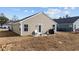 Backyard patio featuring seating area and grill, perfect for outdoor entertaining at 141 Foxford Dr., Conway, SC 29526
