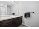 Bathroom featuring a double sink vanity with dark wood cabinets and a large mirror at 141 Foxford Dr., Conway, SC 29526