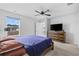 Comfortable bedroom featuring a wood-framed bed, wooden dresser and a ceiling fan for a relaxing space at 141 Foxford Dr., Conway, SC 29526