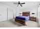 Cozy bedroom with a wood-framed bed, soft carpet, a ceiling fan, and bedside tables with lamps at 141 Foxford Dr., Conway, SC 29526