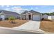 Charming single-story home with a well-manicured lawn and a one-car garage at 141 Foxford Dr., Conway, SC 29526