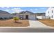 Cozy one-story home featuring a tidy front yard and a convenient one-car garage at 141 Foxford Dr., Conway, SC 29526