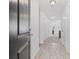 Hallway with wood flooring and natural light, leading to other rooms in the house at 141 Foxford Dr., Conway, SC 29526