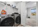 Convenient laundry room with stainless steel washer and dryer and storage shelves at 141 Foxford Dr., Conway, SC 29526
