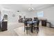 Bright living room featuring a ceiling fan, a dining area and comfortable brown reclining sofas at 141 Foxford Dr., Conway, SC 29526
