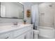 Clean bathroom with white vanity and shower/tub combo at 146 Caroline Ct., Murrells Inlet, SC 29576