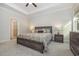 Spacious bedroom with wood-toned furniture and neutral decor at 146 Caroline Ct., Murrells Inlet, SC 29576