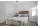 Bright bedroom with a wood bed frame and tropical bedding at 146 Caroline Ct., Murrells Inlet, SC 29576
