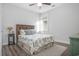 Cozy bedroom with a wood bed frame and tropical bedding at 146 Caroline Ct., Murrells Inlet, SC 29576