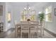 Bright dining room with a table for six and access to the backyard at 146 Caroline Ct., Murrells Inlet, SC 29576