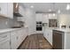 Spacious kitchen with white cabinets, stainless steel appliances and a large island at 146 Caroline Ct., Murrells Inlet, SC 29576