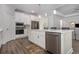Modern kitchen boasting stainless steel appliances and white cabinetry at 146 Caroline Ct., Murrells Inlet, SC 29576