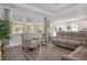 Bright living room with hardwood floors and large windows at 146 Caroline Ct., Murrells Inlet, SC 29576
