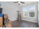Empty spare bedroom with wood floors, cat tree, and window at 146 Caroline Ct., Murrells Inlet, SC 29576