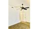 Bedroom featuring neutral colored carpet and walls with a dark ceiling fan at 15 Century St. # 15, Myrtle Beach, SC 29577