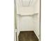 Interior closet with brown carpet and white walls with shelves and clothes hanging rack at 15 Century St. # 15, Myrtle Beach, SC 29577