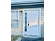 Clean exterior of home showcasing a white front door with a window and an outside light fixture at 15 Century St. # 15, Myrtle Beach, SC 29577