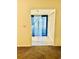 Inviting hallway featuring tiled floors and a view of a bright, sunny window with curtains at 15 Century St. # 15, Myrtle Beach, SC 29577