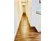 Hallway with wood-look flooring, leading from a kitchen area at 15 Century St. # 15, Myrtle Beach, SC 29577