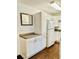 Functional kitchen with white cabinets, updated appliances, and durable countertops, creating a practical cooking area at 15 Century St. # 15, Myrtle Beach, SC 29577