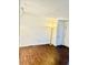 Spacious living room with wood floors, a lamp, and a white door at 15 Century St. # 15, Myrtle Beach, SC 29577