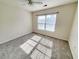 Bright bedroom with neutral walls and carpet at 155 E Chenoa Dr. # E, Murrells Inlet, SC 29576