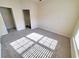 Bright bedroom with neutral carpeting and ample closet space at 155 E Chenoa Dr. # E, Murrells Inlet, SC 29576