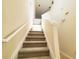 Carpeted staircase leading to the upper level at 155 E Chenoa Dr. # E, Murrells Inlet, SC 29576