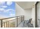 Balcony with chair and partial ocean view at 2001 S Ocean Blvd. # 811, Myrtle Beach, SC 29577