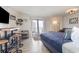 Studio bedroom with a king-size bed, kitchenette, and ocean view at 2001 S Ocean Blvd. # 811, Myrtle Beach, SC 29577