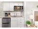 Small kitchenette with microwave, sink, and mini-fridge at 2001 S Ocean Blvd. # 811, Myrtle Beach, SC 29577