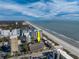Aerial perspective highlighting the building's beachfront location and surroundings at 202 75Th Ave. N # 5604/5605, Myrtle Beach, SC 29572