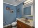 Small bathroom with wood vanity, toilet and decorative accents at 202 75Th Ave. N # 5604/5605, Myrtle Beach, SC 29572
