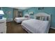 Guest bedroom with two twin beds and ocean themed decor at 202 75Th Ave. N # 5604/5605, Myrtle Beach, SC 29572