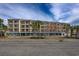 Building exterior with parking and ocean view at 202 75Th Ave. N # 5604/5605, Myrtle Beach, SC 29572